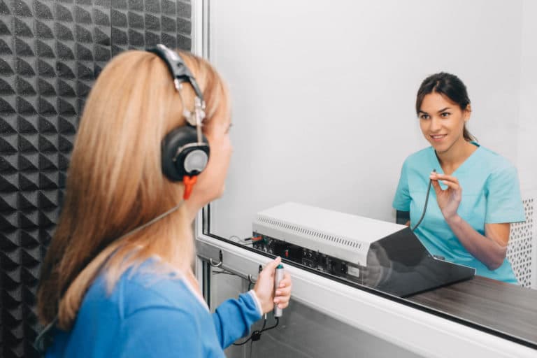 Audiologist Giving Hearing Evaluation