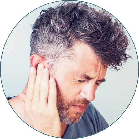 Man holding his ear in pain