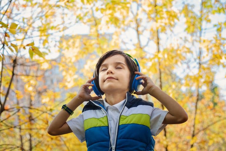 photo of a young boy wearing headphones